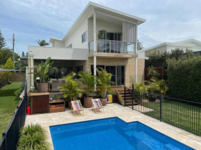 Flynns executive coastal home with pool